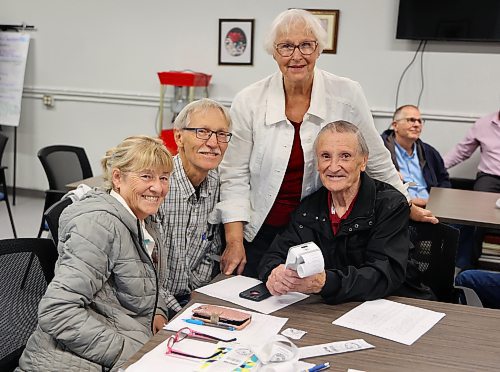 Bride Meehan, Larry Grime, Joyce Hopper and Richard McIntyre are all smiles while they take training for the new round of Smack the Jack at Seniors for Seniors in Brandon on Monday. (Michele McDougall/The Brandon Sun)