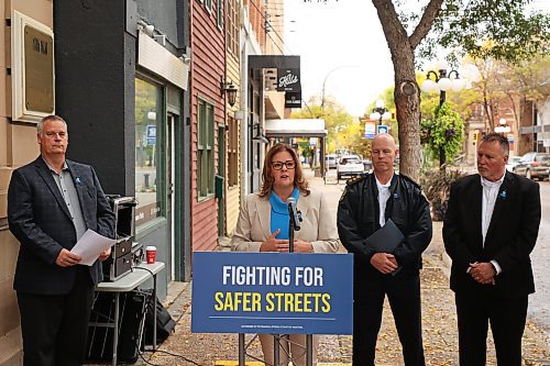 Progressive Conservative Leader Heather Stefanson is flanked by Brandon West PC candidate Wayne Balcaen, acting Brandon Police Service Chief Randy Lewis and Brandon East PC candidate Len Isleifson during an announcement in downtown Brandon on Monday. (Tim Smith/The Brandon Sun)