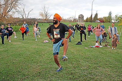 Sikh-Canadian performer, author and social-media celebrity Gurdeep Pandher teaches Brandonites Bhangra dance at Dinsdale Park on Monday evening while promoting a message of happiness, hope and positivity. Pandher's videos of himself performing the Bhangra dance on a frozen lake in the Yukon, where he lives, went viral during the COVID-19 pandemic. He is currently touring across Canada to share his message and love of dance. See more photos on Page A5. (Tim Smith/The Brandon Sun)
