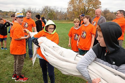 Grade 7 and 8 students from École New Era School help raise a teepee during a Truth and Reconciliation Week event at the Riverbank Discovery Centre on Tuesday afternoon. A number of events and teachings are happening all week at the Discovery Centre. (Tim Smith/The Brandon Sun)
