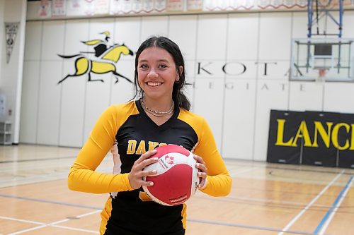 BROOK JONES / WINNIPEG FREE PRESS
Dakota Collegiate Lancers athlete Payton Cvetkovic holds a volleyball while inside the school's gym in Winnipeg, Man., Tuesday, Sept. 26, 2023. The Grade 11 student has played on 11 school sports for the Lancers, such as cross country, track &amp; field, lacrosse, volleyball, basketball, soccer and rugby. 