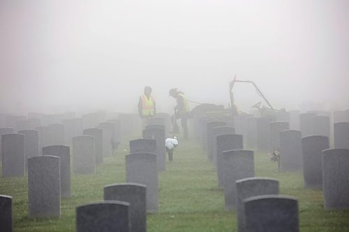 26092023
Workers are shrouded in fog at the Brandon Municipal Cemetery on a cool Tuesday morning. Thick fog blanketed the wheat city throughout the morning. 
(Tim Smith/The Brandon Sun)26092023
A woman walks a dog through the fog at the Brandon Municipal Cemetery on a cool Tuesday morning. Thick fog blanketed the wheat city throughout the morning. 
(Tim Smith/The Brandon Sun)