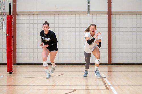 BROOK JONES / WINNIPEG FREE PRESS
University of Manitoba Bisons women's volleyball players six-foot middle Simone Crevier (left) and five-foot-nine right side hitter Keziah Hoeppner warm up during a team practice.  The volleyball players back on the hard court as they are recovering from injuries. Crevier is recovering from a torn labrum in both of her shoulders, whereas, Hoeppner is recovering from a torn ACL and meniscus. The volleyball duo were pictured at the Investors Group Athletic Centre on the Fort Garry Campus at the University of Manitoba in Winnipeg, Man., Tuesday, Sept. 26, 2023.