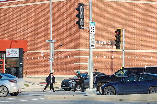 MIKE DEAL / WINNIPEG FREE PRESS
Pedestrians cross St. Mary&#x2019;s Road at Fermor Avenue Wednesday morning. 
A pedestrian was killed in a collision at the intersection of St. Mary&#x2019;s Road and Fermor Avenue on Tuesday night, police told multiple news organizations Wednesday morning.
230927 - Wednesday, September 27, 2023