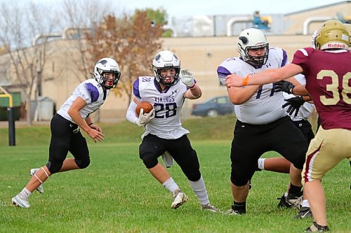 Brayden Smith (28) rushed for 172 yards and four touchdowns for the Vikings. (Thomas Friesen/The Brandon Sun)