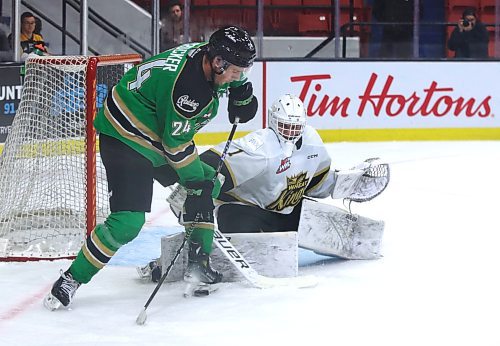 Brandon Wheat Kings goaltender Ethan Eskit (1) keeps a close eye on Prince Albert Raiders forward Niall Crocker (24) during the first period of their Western Hockey League game at Westoba Place on Wednesday. (Perry Bergson/The Brandon Sun)
