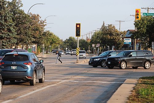 MIKE DEAL / WINNIPEG FREE PRESS
Pedestrians cross St. Mary&#x2019;s Road at Fermor Avenue Wednesday morning. 
A pedestrian was killed in a collision at the intersection of St. Mary&#x2019;s Road and Fermor Avenue on Tuesday night, police told multiple news organizations Wednesday morning.
230927 - Wednesday, September 27, 2023
