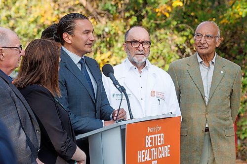 MIKE DEAL / WINNIPEG FREE PRESS
Manitoba NDP leader Web Kinew along with several well known doctors and health leaders announced during a campaign stop near the entrance to the Niakwa Country Club Wednesday morning that his party is committed &#x201c;to fix Manitoba health care by listening to frontline health leaders and changing the culture within health care in Manitoba.&#x201d; 
230927 - Wednesday, September 27, 2023.