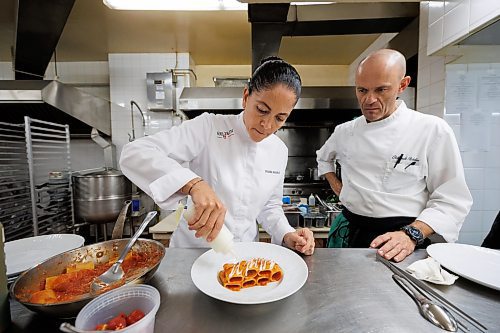 MIKE DEAL / WINNIPEG FREE PRESS
In a kitchen at the Fort Garry Hotel Tuesday afternoon while Rosanna Marziale, a Michelin-starred chef from Italy is in town for the soon to open high-end-ish eatery, Vida Cucina Italia. Working with sous chef Oleksandr &#x201c;Sasha&#x201d; Bohdan, Rosanna prepares dishes from the menu.
Paccheri di Gragnano ai Tre Pomodori
paccheri, San Marzano DOP tomatoes, plum tomatoes IGP, fresh cherry tomato sauces, buffalo mozzarella milk DOP, Grana Padano DOP
See Ben Sigurdson story
230829 - Tuesday, August 29, 2023.