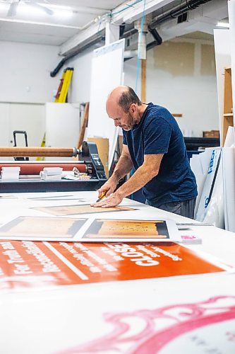 MIKAELA MACKENZIE / WINNIPEG FREE PRESS

Don Gaye, owner of The Sign Source, cuts out signs (destined for Boo in the Zoo) in his shop on Thursday, Sept. 28, 2023. For Maggie story.
Winnipeg Free Press 2023.