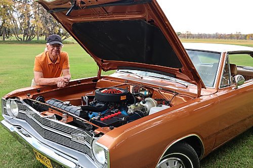 Lynn Flewitt with his 1969 Dodge Dart Swinger two-door hard-top at a park west of Brandon on Thursday. (Michele McDougall/The Brandon Sun)