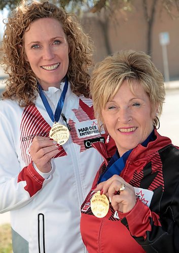 Maureen Bonar (left) and Lois Fowler show their world senior women's curling championship gold medals. (Brandon Sun files)