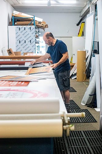 MIKAELA MACKENZIE / WINNIPEG FREE PRESS

Don Gaye, owner of The Sign Source, cuts out signs (destined for Boo in the Zoo) in his shop on Thursday, Sept. 28, 2023. For Maggie story.
Winnipeg Free Press 2023.