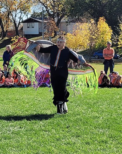 Dancer Raven Wabash from Waywayseecappo First Nation performs a shawl dance for students who gathered in Neepawa to learn about Indigenous Culture on a sunny, warm Friday afternoon. (Miranda Leybourne/The Brandon Sun)