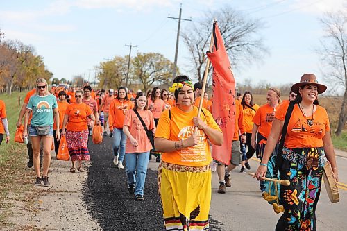Hundreds of people march down Wokiksuye Ċanku (Remembrance Road) during Brandon’s Orange Shirt Day festivities. The crowd’s final destination was the site of the old Brandon Indian Residential School, which was founded in 1895 and ceased operations in 1972. (Kyle Darbyson/The Brandon Sun)