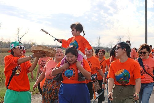 Three-year-old Emelia Malyon takes over drumming duties as Brandon’s Orange Shirt Day participants return to the Riverbank Discovery Centre grounds following their visit to the Brandon Indian Residential School site. (Kyle Darbyson/The Brandon Sun)