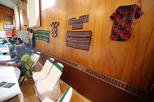 Some Nigerian traditional wears displayed on the wall at the event  (Abiola Odutola/The Brandon Sun)