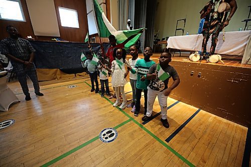 Some children displaying the Nigerian Flags at the event  (Abiola Odutola/The Brandon Sun)