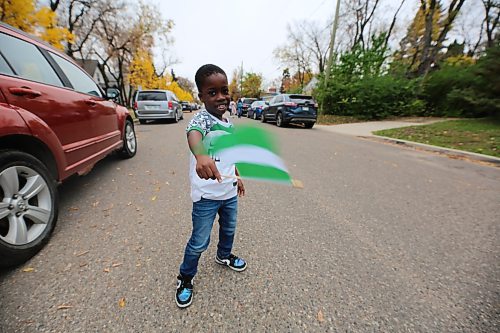 One of the children waves the Nigerian flag at the event. (Abiola Odutola/The Brandon Sun)