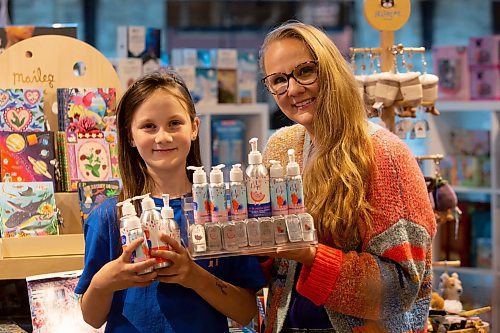 BROOK JONES / WINNIPEG FREE PRESS
Alisha Talbot (right), who is the founder of Lil Lippy, holds her vegan kids' skincare brand of products at the Forks Trading Company inside The Forks Market in Winnipeg, Man., Sunday, Oct. 1, 2023. The makeup artist was inspired to create the skincare products because of her daughter Lillian Fuller. Talbot is gearing up for her first Christmas holiday season selling Lil Lippy, which includes skincare lotions and lip balms.