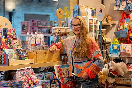 BROOK JONES / WINNIPEG FREE PRESS
Alisha Talbot, who is the founder of Lil Lippy, stands next to her vegan kids' skincare brand of products at the Forks Trading Company inside The Forks Market in Winnipeg, Man., Sunday, Oct. 1, 2023. The makeup artist was inspired to create the skincare products because of her daughter Lillian Fuller. Talbot is gearing up for her first Christmas holiday season selling Lil Lippy, which includes skincare lotions and lip balms.