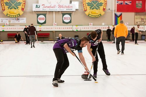 BROOK JONES / WINNIPEG FREE PRESS
Keystone Curling is celebrating 31 teams this season. The league, which is made up of LGBT2SQ+ and gender, sexually and romantically diverse people curl at the Granite Curling Club. The league kicked off its 2023-2023 season Sunday, Oct. 1, 2023. Pictured: Keystone Rainbow Curling League President Mark Lawson (left) sweeps ahead of the rock with teammate Ryan Miller.