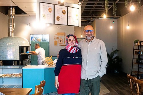 MIKAELA MACKENZIE / WINNIPEG FREE PRESS

Owner Fawaz Alsayeh and his wife, Batoul Hussein, at Winnibakes, a new Middle Eastern Levantine bakery in Lindenwoods, on Monday, Oct. 2, 2023. For Eva story.
Winnipeg Free Press 2023.