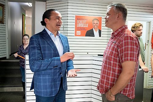 BROOK JONES / WINNIPEG FREE PRESS
Manitoba NDP Party Leader Wab Kinew (left) visits with the NDP candidate for St. Boniface Robert Loiselle on election day in Manitoba at his campaign office in Winnipeg, Man., Tuesday, Oct. 3, 2023. Manitobans are voting in the Manitoba Provincial Election Tuesday, Oct. 3, 2023.