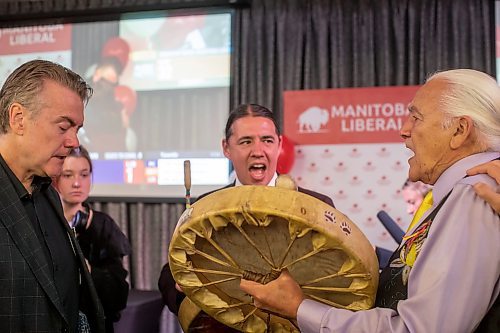 BROOK JONES / WINNIPEG FREE PRESS
Manitoba Liberal Party leader and candidate for St. Boniface Dougald Lamont shows his emtions, while Elder Winston Wuttunee (right), who is from Red Pheasant Cree Nation, Sask., and Liberal candidate for Southdale Robert-Falcon Ouellette sing a warrior song to comfort Lamont at election night party headquarters at the Norwood Hotel in Winnipeg, Man., Tuesday, Oct. 3, 2023. During his concession speech, Lamont announced he is stepping down as party leader. He also lost (unofficial results) his seat in St. Boniface to Manitoba NDP Party candidate Robert Loiselle.