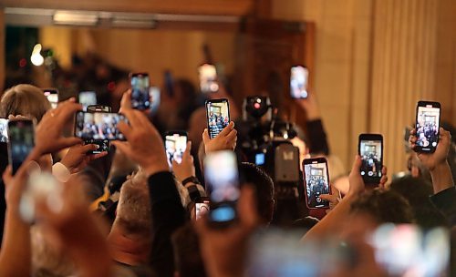 JASON HALSTEAD / WINNIPEG FREE PRESS

NDP hold up phones and cameras as leader Wab Kinew approaches the stage on Oct. 3, 2023 at the Fort Garry Hotel.
