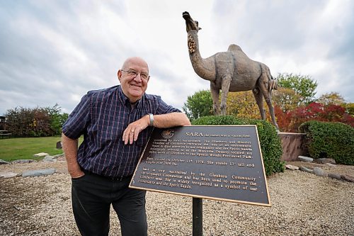 RUTH BONNEVILLE / WINNIPEG FREE PRESS 
49.8 - Glenboro feature 
Glenboro Field Trip with stop at Stockton Ferry which is nearby. Photo of Earl Malyon (former mayor) in front of the town's cam el mascot named Sara. 
AV Kitching (she/her) Arts & Life writer

