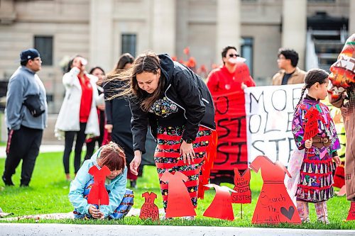 MIKAELA MACKENZIE / WINNIPEG FREE PRESS

Harlee-Quinn Laplante (left, seven) and Jessica Thomas put red dress signs into the grass at the Manitoba Legislative Building for National Day of Action for Missing and Murdered Indigenous Women, Girls and Gender Diverse People on Wednesday, Oct. 4, 2023.
Winnipeg Free Press 2023.
