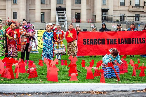MIKAELA MACKENZIE / WINNIPEG FREE PRESS

Harlee-Quinn Laplante (seven) puts red dress signs into the grass at the Manitoba Legislative Building for National Day of Action for Missing and Murdered Indigenous Women, Girls and Gender Diverse People on Wednesday, Oct. 4, 2023.
Winnipeg Free Press 2023.
