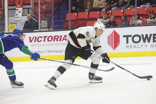 04102023
Dominik Petr #82 of the Brandon Wheat Kings skates in for a shot on Prince Albert Raiders netminder Chase Coward during WHL action at Westoba Place on Wednesday evening. (Tim Smith/The Brandon Sun) 