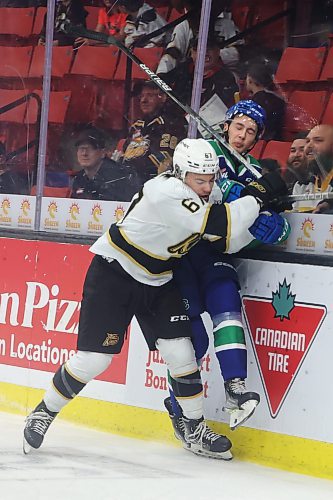 04102023
Matt Henry #67 of the Brandon Wheat Kings checks Tyrone Sobry #2 of the Prince Albert Raiders into the glass during WHL action at Westoba Place on Wednesday evening. (Tim Smith/The Brandon Sun) 