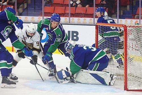 Brandon Wheat Kings forward Nolan Flamand tries to get the puck past netminder Chase Coward of the Swift Current Broncos during WHL action at Westoba Place on Wednesday evening. (Tim Smith/The Brandon Sun) 