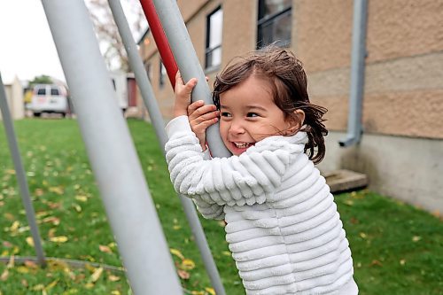 05102023
Four-year-old Ava Armstrong plays with her siblings at the metal tipi on 9th Street in Brandon on a cool and grey Thursday.   (Tim Smith/The Brandon Sun) 