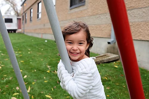 05102023
Four-year-old Ava Armstrong plays with her siblings at the metal tipi on 9th Street in Brandon on a cool and grey Thursday.   (Tim Smith/The Brandon Sun) 