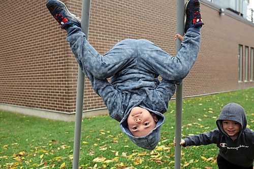 05102023
Grayson Armstrong and his brother Sam play at the metal tipi on 9th Street in Brandon on a cool and grey Thursday.   (Tim Smith/The Brandon Sun) 