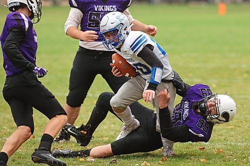 Hunter Reichert of the Vincent Massey Vikings tackles Kevan Savage of the Oak Park Raiders during Winnipeg High School Football League AAAA action at Doug Steeves Field on Friday afternoon. (Tim Smith/The Brandon Sun)