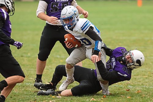 06102023
Hunter Reichert #99 of the Vincent Massey Vikings tackles Kevan Savage #20 of the Oak Park Raiders during high school football action at VMHS on Friday afternoon. 
(Tim Smith/The Brandon Sun)