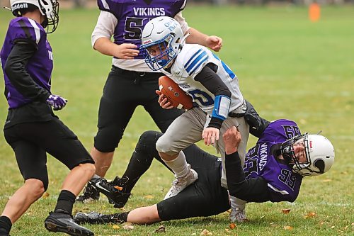 06102023
Hunter Reichert #99 of the Vincent Massey Vikings tackles Kevan Savage #20 of the Oak Park Raiders during high school football action at VMHS on Friday afternoon. 
(Tim Smith/The Brandon Sun)