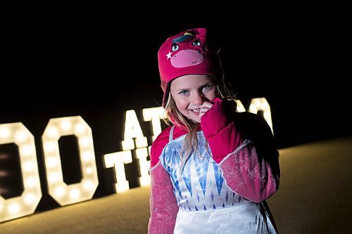 BROOK JONES / WINNIPEG FREE PRESS
Boo at the Zoo at the Assiniboine Park Zoo in Winnipeg Man., features a number of performers as well as plenty of Halloween fun. Boo at the Zoo run Oct. 6 to . 29. Pictured: Five-year-old Elena Greene stands in front of a large light up sign, which was popular for selfies on opening night of Boo at the Zoo Friday, Oct. 6, 2023. Greene was seen having her photo taken by her parents with her eight-year-old brother Eli a moment earlier.