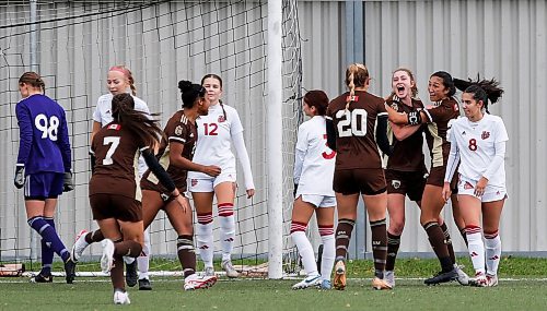 JOHN WOODS / WINNIPEG FREE PRESS
University of Manitoba Bisons&#x2019; Evelyn Lekivetz (3) and her teammates celebrate her goal against the University of Winnipeg Wesmen at the Ralph Cantafio Complex Sunday, October 8, 2023.

Reporter: ?