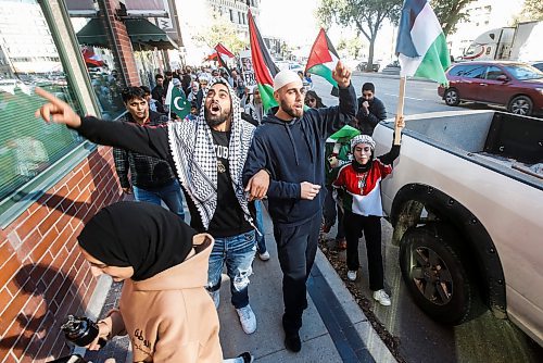 JOHN WOODS / WINNIPEG FREE PRESS
About 150 Palestinian supporters rally outside City Hall and throughout the Exchange District as six Israel supporters gather on the opposite side of Main Street in Winnipeg Monday, October 9, 2023. 

Reporter: searles