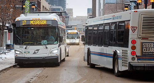 MIKE DEAL / WINNIPEG FREE PRESS
A Winnipeg Transit bus drives along Graham Avenue Thursday afternoon.
230126 - Thursday, January 26, 2023.