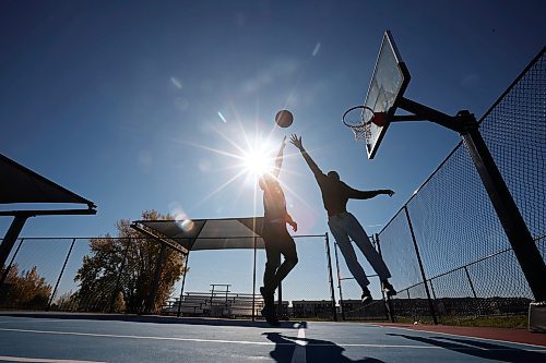 10102023
Jackson Doty and Victor Aderemi-Fawoye shoot hoops together at the Jumpstart Multi Sport Court in Brandon&#x2019;s south end on a beautiful Tuesday afternoon. (Tim Smith/The Brandon Sun)