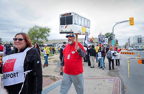 RUTH BONNEVILLE / WINNIPEG FREE PRESS

LOCAL - transit picket

Chris Scott, Union President of The Amalgamated Transit Union local 1505 holds an information picket in front of the Fort Rouge Garage with many union members walking the picket line to &quot;practice&quot; their stance on talks, Wednesday. 

&#x494;he rally serves as a demonstration of the union&#x573; resolve to secure fair wages and uphold working conditions that prioritize the well-being of transit workers. Despite nine months of negotiations, conciliation between ATU Local 1505 and the employer has reached an impasse, leaving no mutually agreeable terms to present to the membership for a vote.&#x4e0; (Quote from the assignment on sched)

October 11th, 2023