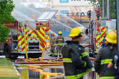 MIKE DEAL / WINNIPEG FREE PRESS
WFPS crews try to douse a large fire in the block on the southwest corner of Sutherland Avenue and Maple Street North Tuesday morning. 
230704 - Tuesday, July 4, 2023. 