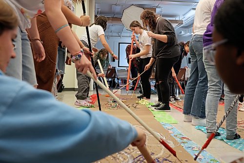 11102023
Girls from &#xc9;cole Secondaire Neelin High School and Prairie Hope High School paint to different types of music to see how the different music alters their artistic style during an International Day of the Girl event at the Art Gallery of Southwestern Manitoba on Wednesday.   
(Tim Smith/The Brandon Sun)